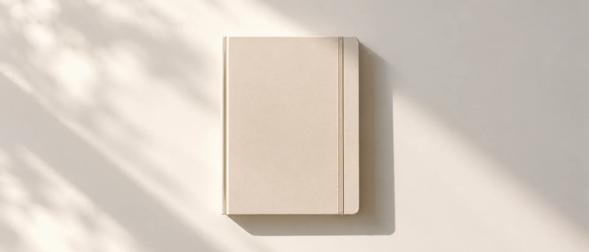 A closed notebook on a plain surface